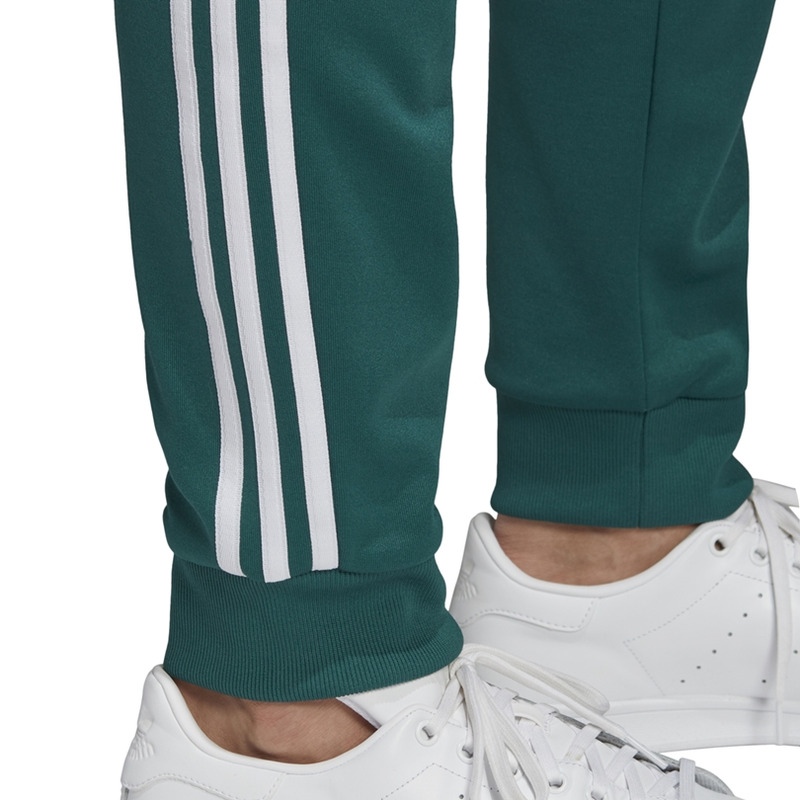 Adidas sst track pants noble green best sale